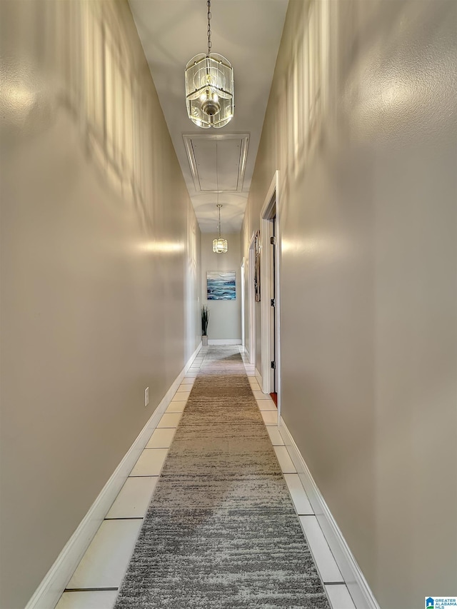 385 Rouse Rd, Sumiton, AL 35148 - hallway featuring attic access, light tile patterned floors, and baseboards