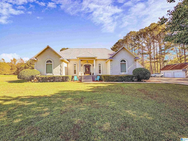 385 Rouse Rd, Sumiton, AL 35148 - mediterranean / spanish home with stucco siding, an outdoor structure, and a front lawn