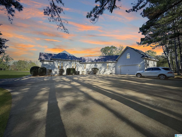 385 Rouse Rd, Sumiton, AL 35148 - view of front of house featuring concrete driveway, a garage, and stucco siding