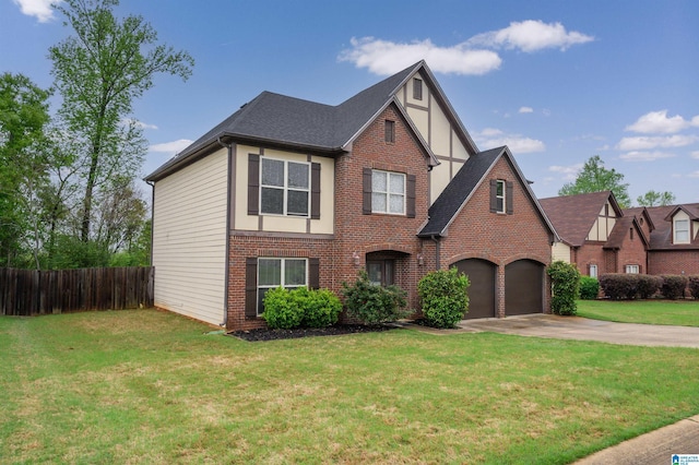 tudor house featuring fence, brick siding, a front lawn, driveway, and roof with shingles
