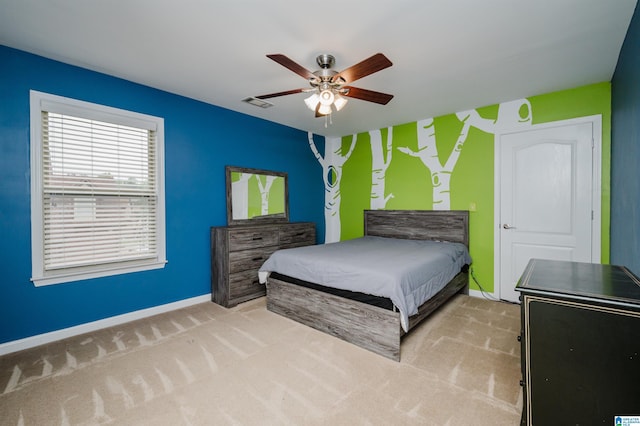 bedroom featuring visible vents, baseboards, ceiling fan, and carpet