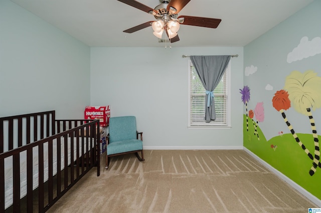 bedroom with carpet flooring, baseboards, and a ceiling fan