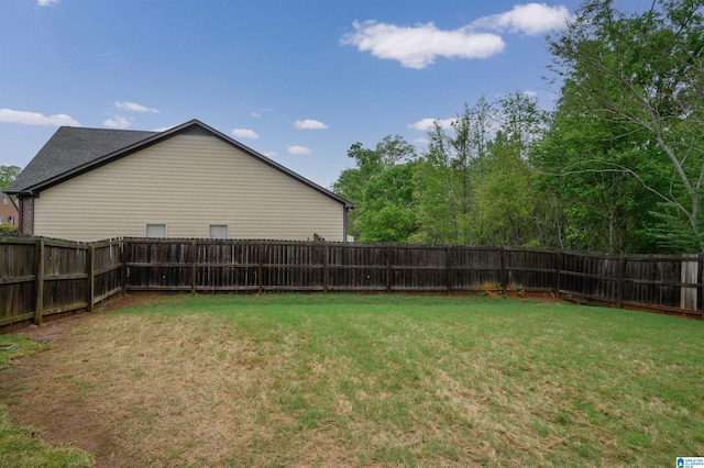 view of yard with a fenced backyard