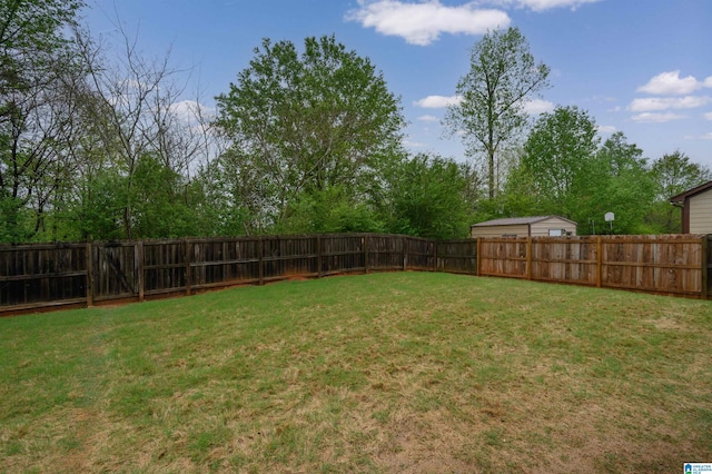 view of yard with a fenced backyard