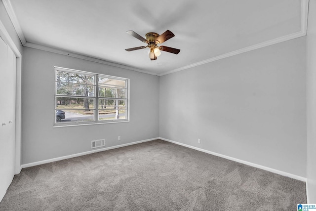817 Milgray Ln, Bessemer, AL 35022 - spare room featuring baseboards, visible vents, ceiling fan, crown molding, and carpet flooring