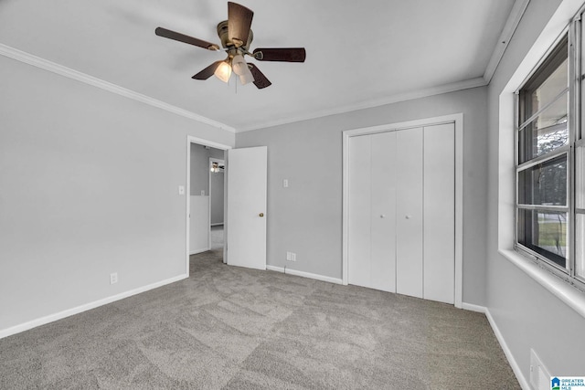 817 Milgray Ln, Bessemer, AL 35022 - unfurnished bedroom featuring crown molding, ceiling fan, baseboards, carpet floors, and a closet
