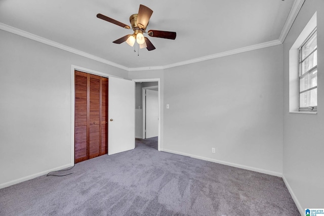 817 Milgray Ln, Bessemer, AL 35022 - unfurnished bedroom featuring a closet, crown molding, baseboards, and carpet floors