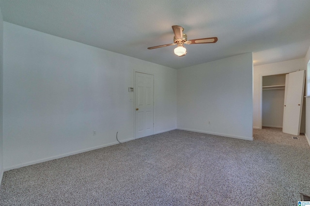 unfurnished bedroom with light carpet, ceiling fan, a closet, and baseboards