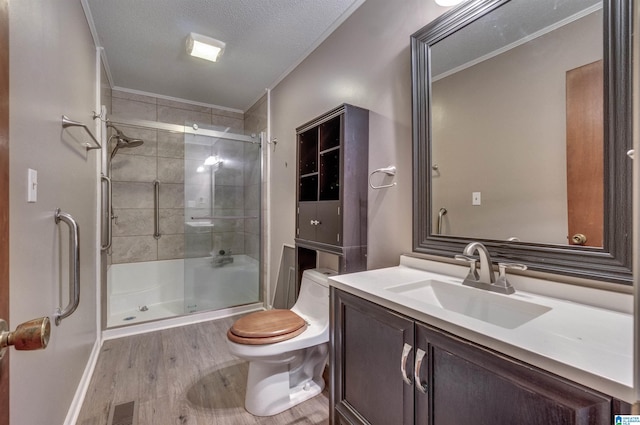 bathroom featuring visible vents, a shower with shower door, toilet, and ornamental molding