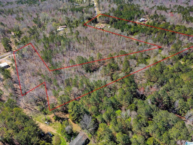 drone / aerial view with a view of trees