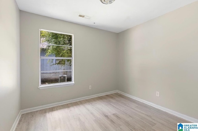 63 Bluebell St, Bessemer, AL 35020 - spare room with wood finished floors, visible vents, and baseboards