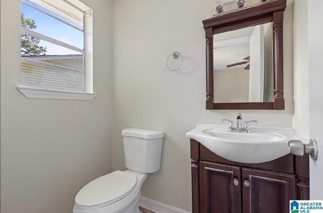63 Bluebell St, Bessemer, AL 35020 - half bathroom with vanity, toilet, and baseboards