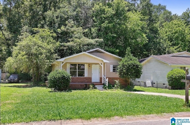 63 Bluebell St, Bessemer, AL 35020 - view of front of home featuring brick siding and a front yard
