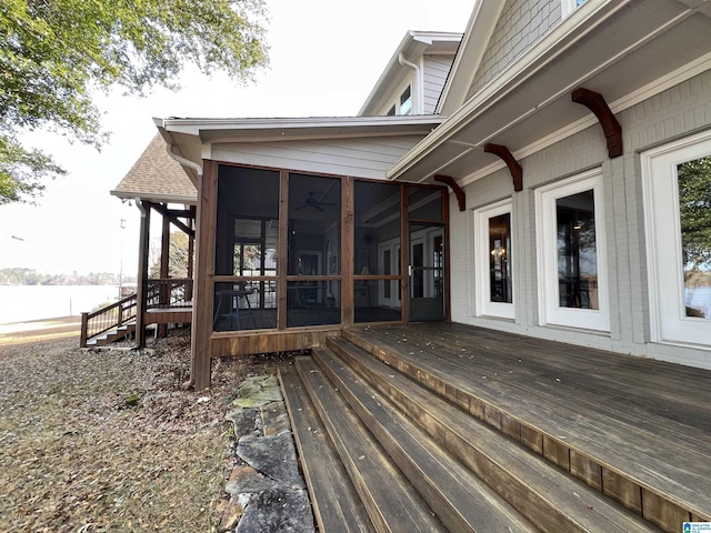 wooden deck featuring a sunroom