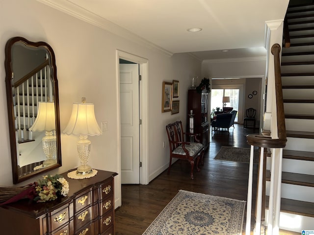 hallway featuring crown molding, stairway, baseboards, and dark wood-style flooring