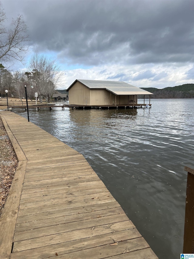dock area featuring a water view