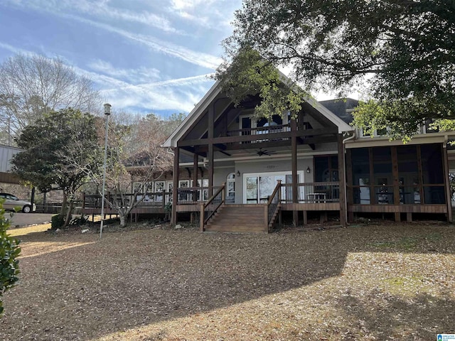 back of property featuring a ceiling fan