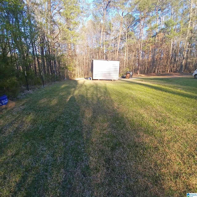 7459 15th Street Rd, Bessemer, AL 35023 - view of yard with an outbuilding and a forest view