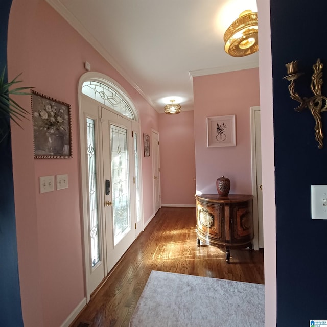 7459 15th Street Rd, Bessemer, AL 35023 - foyer with baseboards, wood finished floors, and crown molding