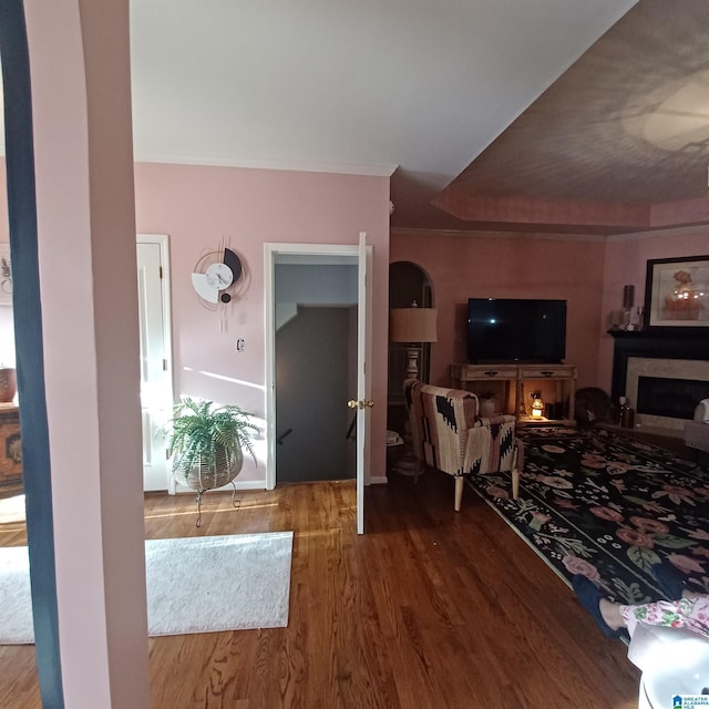 7459 15th Street Rd, Bessemer, AL 35023 - living area with a fireplace, crown molding, wood finished floors, and arched walkways