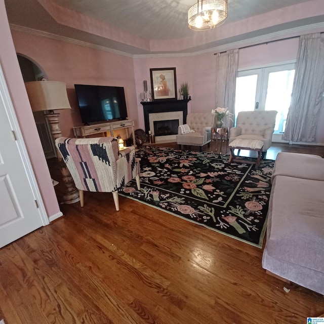 7459 15th Street Rd, Bessemer, AL 35023 - living area featuring a fireplace, a raised ceiling, and wood finished floors