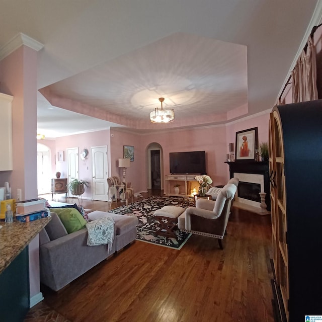 7459 15th Street Rd, Bessemer, AL 35023 - living area with arched walkways, an inviting chandelier, dark wood-style floors, and crown molding
