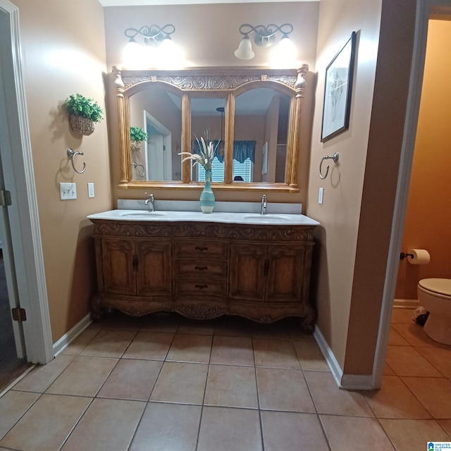 7459 15th Street Rd, Bessemer, AL 35023 - full bath featuring a sink, toilet, double vanity, and tile patterned floors