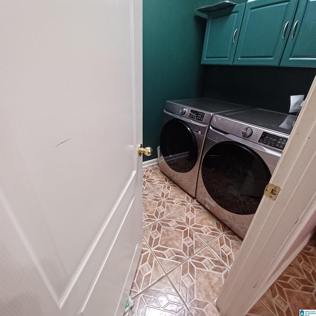 7459 15th Street Rd, Bessemer, AL 35023 - washroom with washing machine and clothes dryer, cabinet space, baseboards, and light tile patterned flooring
