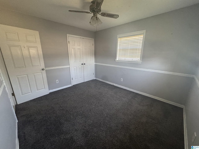 1804 Ragsdale Rd, Cullman, AL 35055 - unfurnished bedroom with dark colored carpet, a closet, baseboards, and ceiling fan