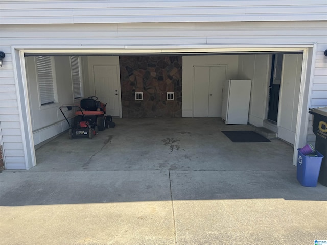 1804 Ragsdale Rd, Cullman, AL 35055 - garage with concrete driveway and freestanding refrigerator