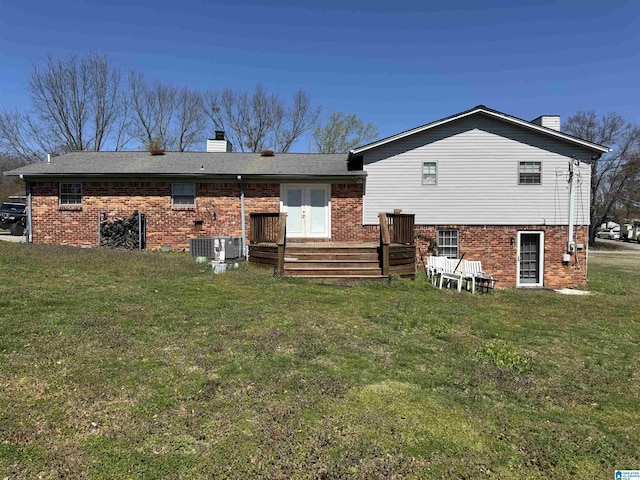 1804 Ragsdale Rd, Cullman, AL 35055 - back of property with french doors, brick siding, a chimney, and a lawn