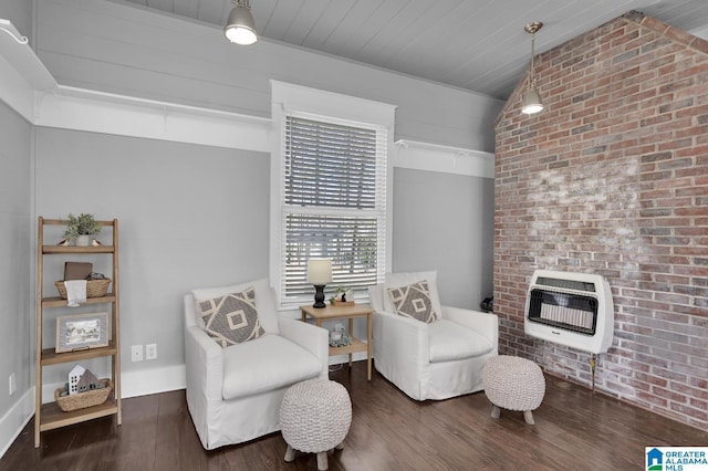 living area with lofted ceiling, wood ceiling, heating unit, and wood finished floors