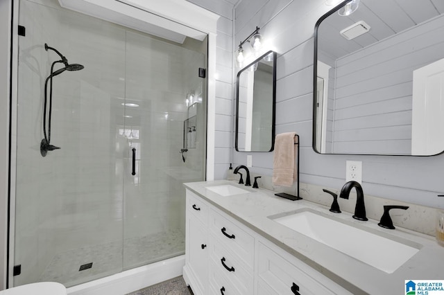 full bathroom with a shower stall and a sink