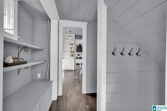 interior space featuring wooden ceiling, lofted ceiling, and dark wood-style flooring