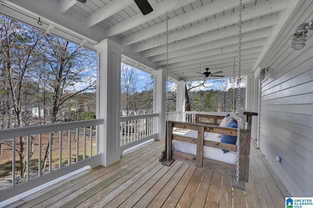 wooden terrace featuring a ceiling fan