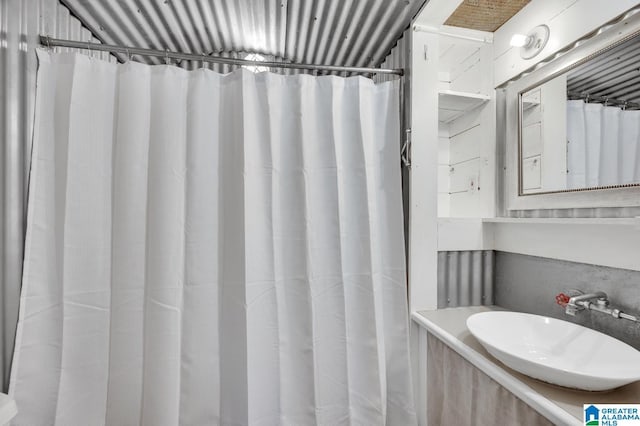 full bath featuring a sink