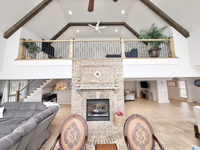 360 Frankies Rd, Vincent, AL 35178 - tiled living area featuring beamed ceiling, high vaulted ceiling, stairway, and a ceiling fan