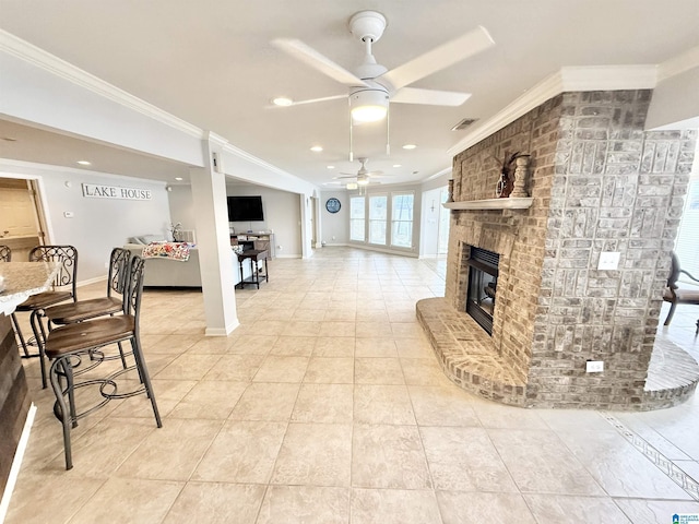 360 Frankies Rd, Vincent, AL 35178 - living room with crown molding, baseboards, a fireplace, a ceiling fan, and light tile patterned floors