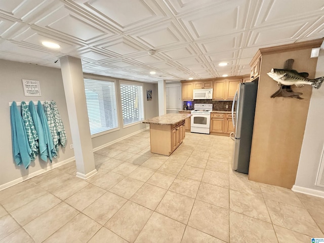 360 Frankies Rd, Vincent, AL 35178 - kitchen featuring tasteful backsplash, white appliances, an ornate ceiling, baseboards, and a kitchen island