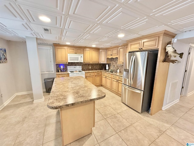 360 Frankies Rd, Vincent, AL 35178 - kitchen with an ornate ceiling, a kitchen island, tasteful backsplash, baseboards, and white appliances