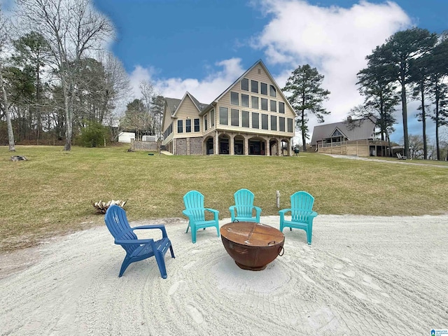 360 Frankies Rd, Vincent, AL 35178 - rear view of house with a patio, stairs, a fire pit, and a yard