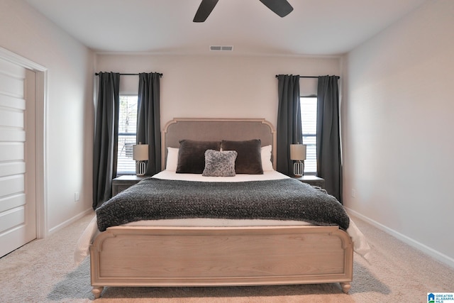 bedroom featuring baseboards, visible vents, and carpet