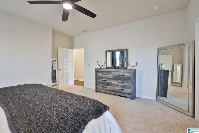 carpeted bedroom with a ceiling fan, baseboards, and visible vents