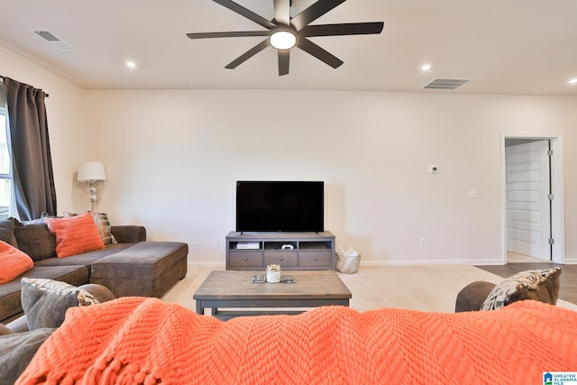 living area featuring recessed lighting, baseboards, ceiling fan, and visible vents