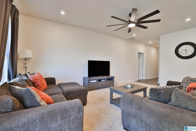 living room with light colored carpet, recessed lighting, baseboards, ceiling fan, and visible vents