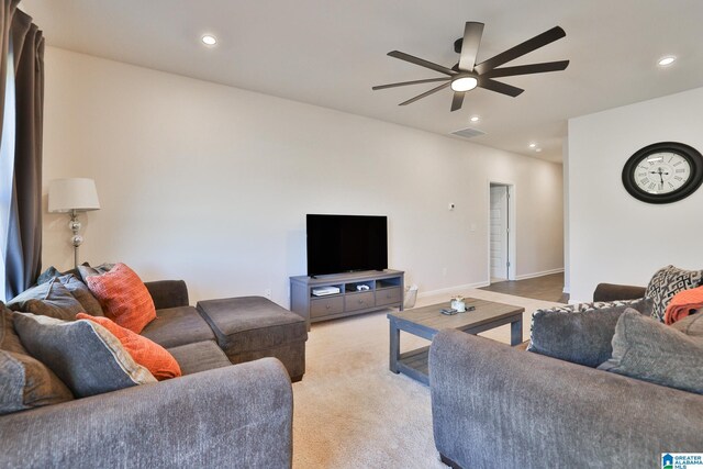 living room featuring visible vents, baseboards, ceiling fan, recessed lighting, and light colored carpet