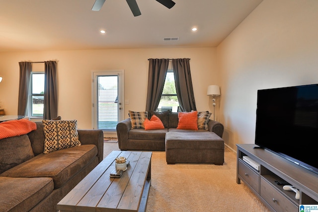 living room featuring light carpet, visible vents, ceiling fan, and recessed lighting