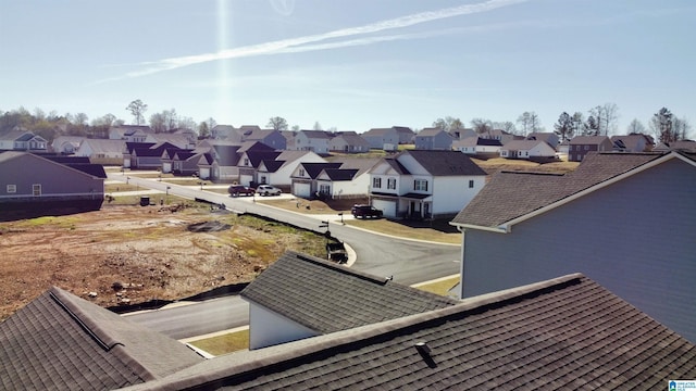 exterior details with a residential view and roof with shingles