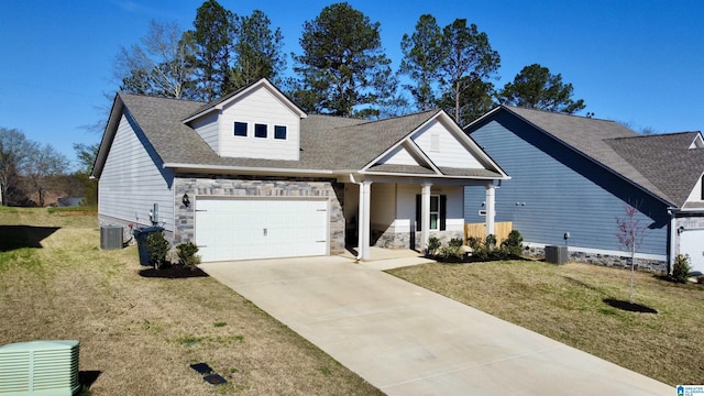view of front facade featuring stone siding, driveway, central AC unit, and a front lawn