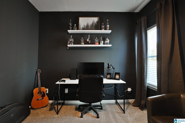 carpeted office space with baseboards